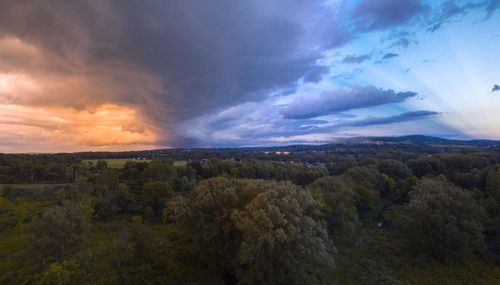 Scenic view of landscape against sky during sunset