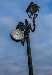 Low angle view of street light against sky