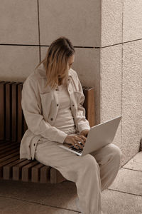 Young woman using laptop at home