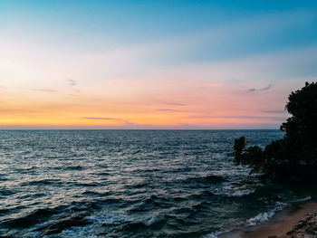 Scenic view of sea against sky during sunset