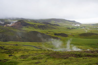 Scenic view of land against sky