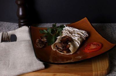 Close-up of bread in plate on table