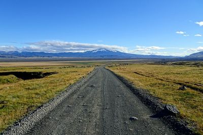 Road amidst landscape against sky