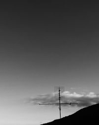 Low angle view of electricity pylon against sky