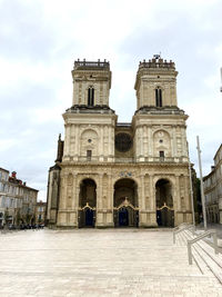 Facade of historic building against sky