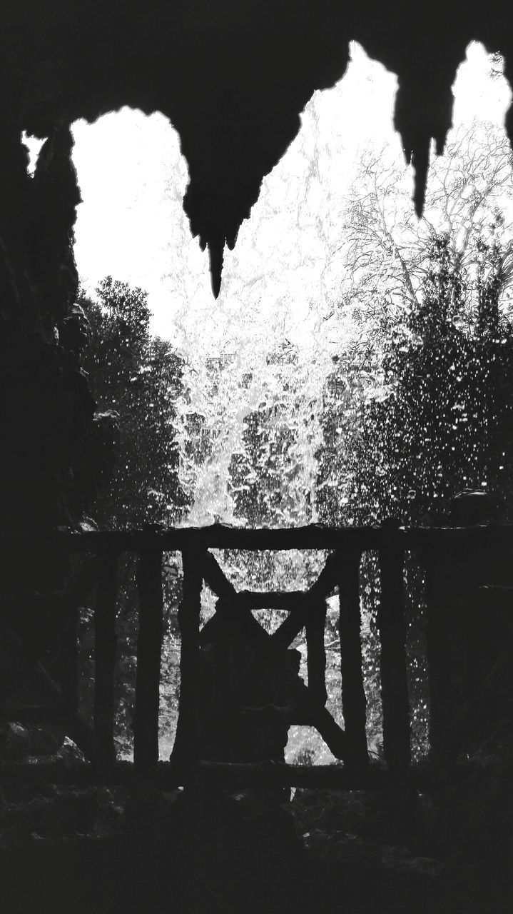 night, water, season, tree, reflection, wet, shadow, railing, weather, nature, auto post production filter, built structure, outdoors, silhouette, street, puddle, sunlight, rain, no people