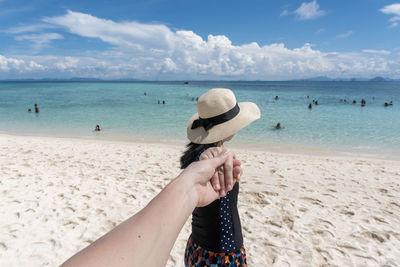 Person in sea against sky