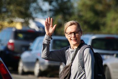 Portrait of young wooman standing on street