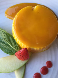 Close-up of yellow icing cake