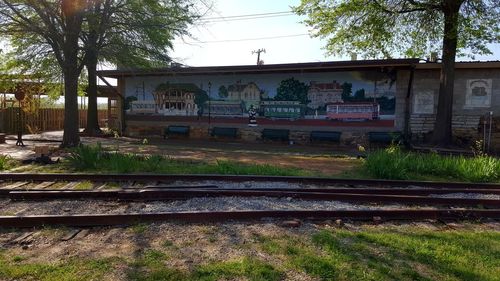 Railroad track with trees in background