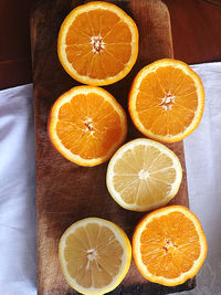 High angle view of oranges and lemons on table