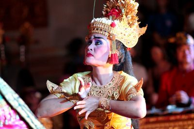 Woman in traditional clothing dancing