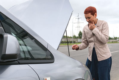 Side view of businessman using mobile phone