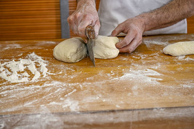 Cropped hand of person preparing food