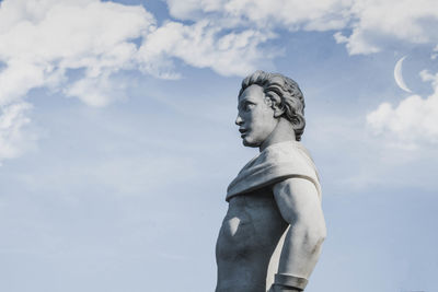 Low angle view of statue against sky