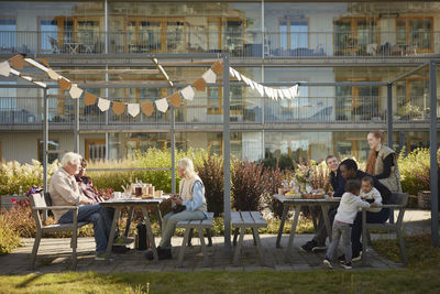 Neighbors relaxing in communal outdoor area