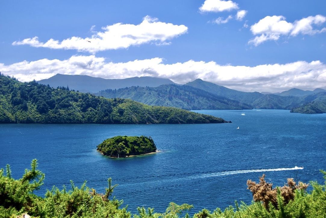 SCENIC VIEW OF BAY AGAINST BLUE SKY