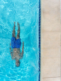 High angle view of man swimming in pool