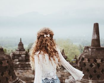 Rear view of girl at borobudur temple