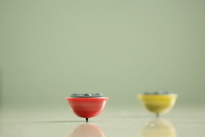 Close-up of red wine glass on table