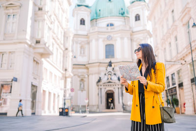 Woman standing in front of building