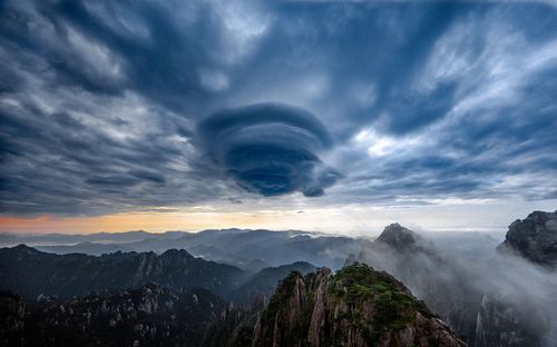 Panoramic view of mountains against sky during sunset