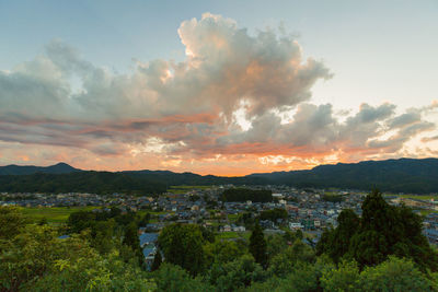 Panoramic view of townscape against sky during sunset