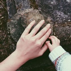 Cropped image of person holding camera