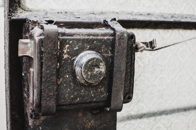 Close-up of old rusty metal door lock