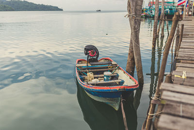 Man on boat moored at sea