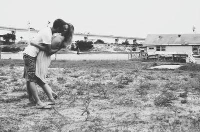 Full length of woman standing on field