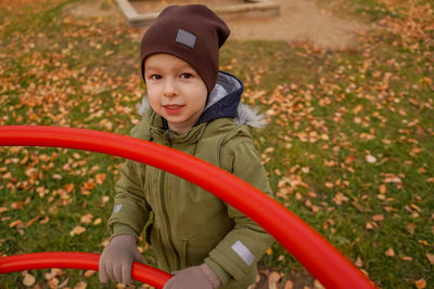 Portrait of boy wearing hat in playground