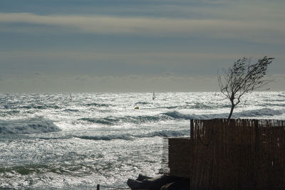 Scenic view of sea against sky during winter
