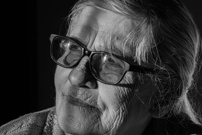 Close-up portrait of man wearing eyeglasses