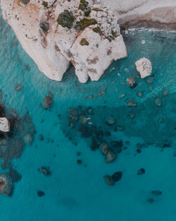 High angle view of rock formation in sea