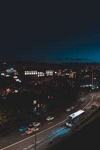 High angle view of illuminated buildings in city at night