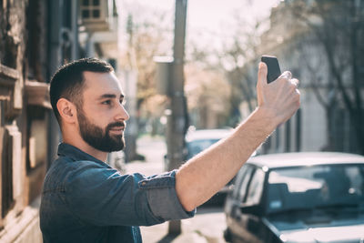 Man taking selfie through smart phone