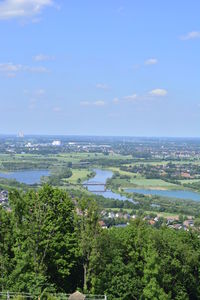 Scenic view of sea and cityscape against sky