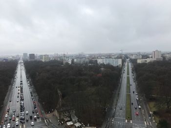 High angle view of vehicles on road against sky