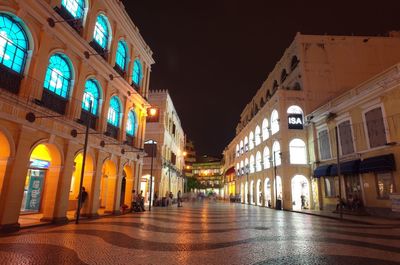 Illuminated buildings in city at night