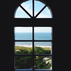 View of sea through window