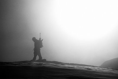 Snowboard and freeride on dolomites and snowpark, black and white with grain