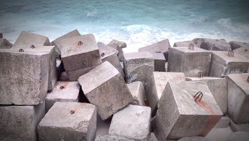 High angle view of stack of stones on beach