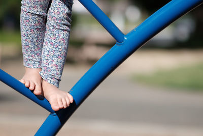 Low section of girl playing in playground
