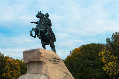 Low angle view of statue against sky