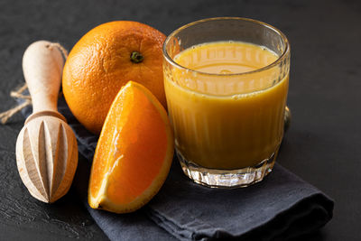 Close-up of orange juice on table