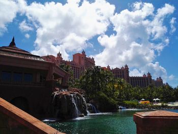 View of buildings against cloudy sky