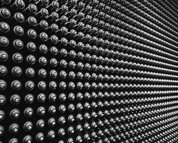 Full frame shot of metal cans on table