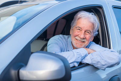 Portrait of woman sitting in car