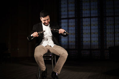 Young man sitting at home